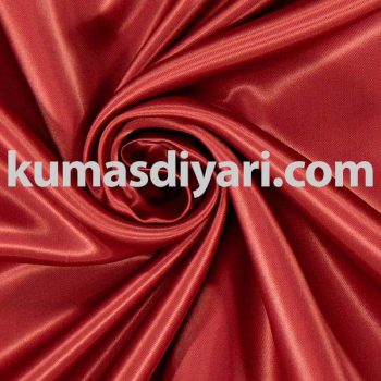 Kırmızı atlas kumaş abiye ve şal yapımında kullanılır